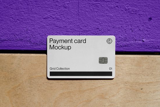 Payment card mockup on wooden desk against purple wall, realistic design, ideal for branding, Grid Collection 01.